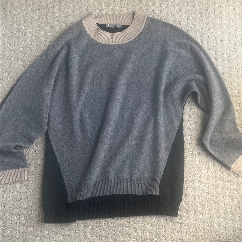 In Cashmere sweater M. Light gray front with tan neckline and dark gray back.